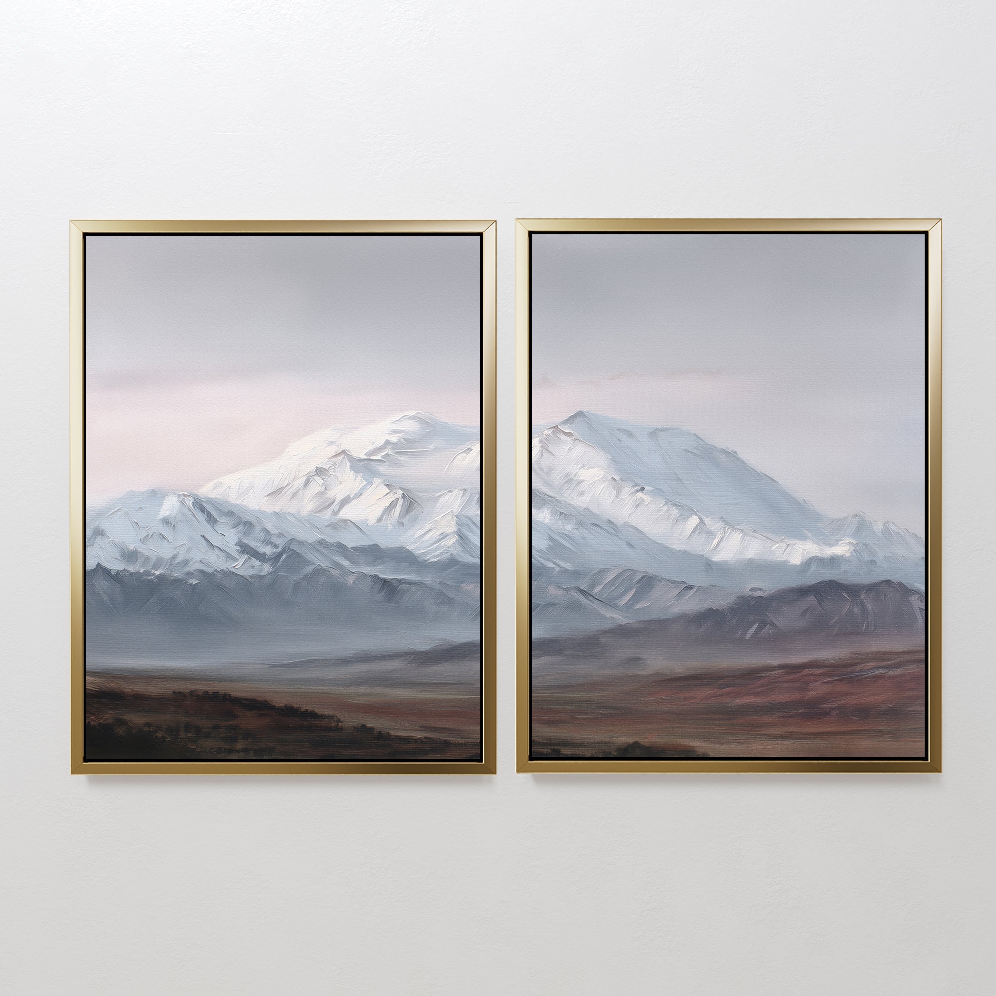 Alpine Majesty - Set of 2 features framed mountain canvas prints depicting snow-capped peaks beneath a cloudy sky above earthy plains. This Nordic-inspired wall art uses cool, muted tones for a calming, serene look.