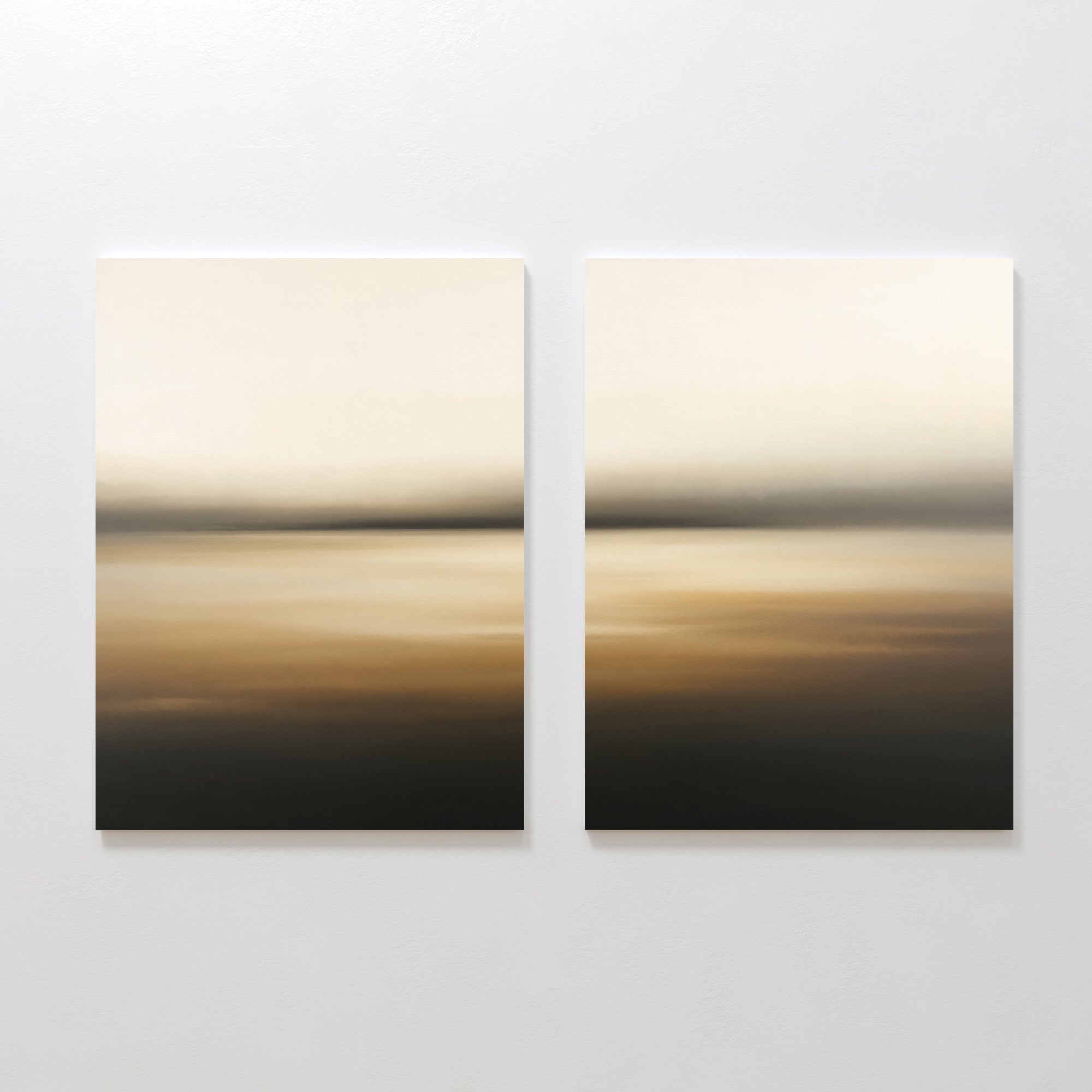 Amber Fields - Set Of 2 features two abstract paintings with horizontal beige and brown gradients, evoking misty horizons. Displayed side by side on a white wall, they're perfect for lovers of atmospheric amber wall art.