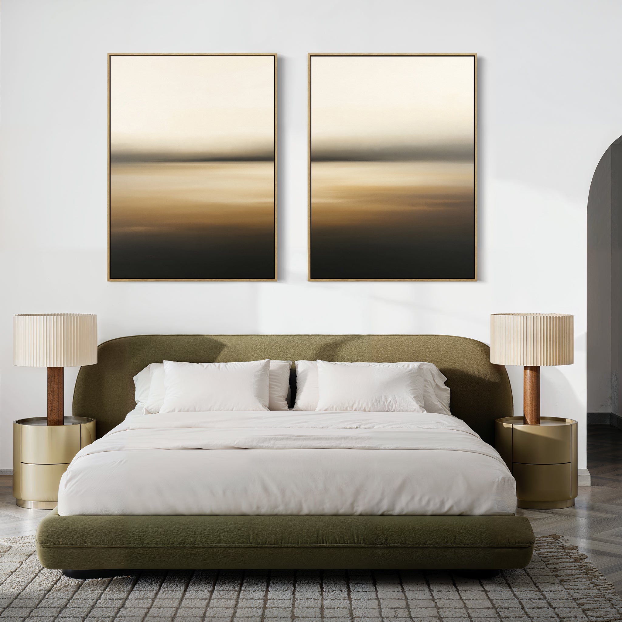A modern bedroom featuring a green upholstered bed, white bedding, beige nightstands, a gray textured rug, and the Amber Fields - Set Of 2 wall art creates a warm, inviting atmosphere.