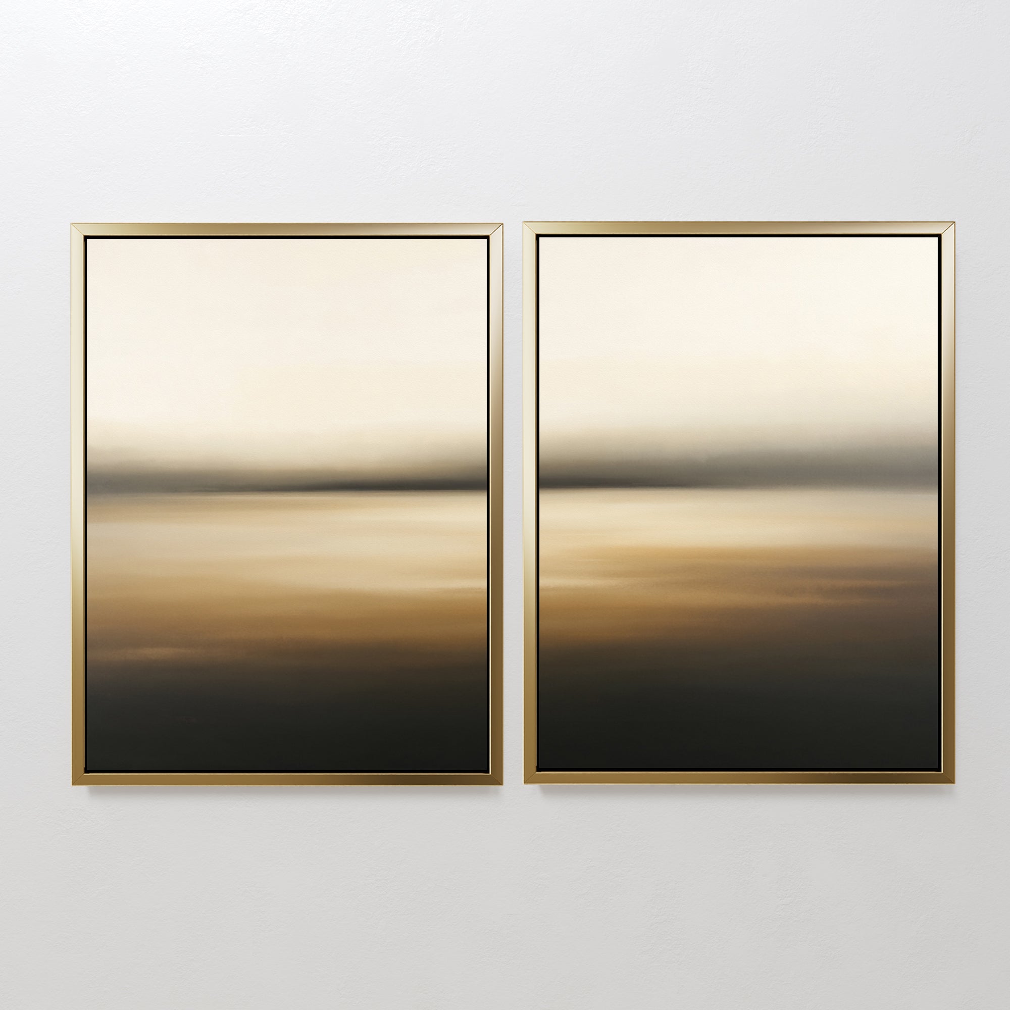 Amber Fields - Set Of 2 features framed abstract prints with soft horizontal gradients in cream, beige, brown, and black, creating a serene Nordic park vibe. These atmospheric landscape artworks are displayed side by side on a white wall.