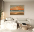 A modern living room with a light beige sectional sofa, a low wooden coffee table with a black bowl, a tall lamp, and the Amber Horizon Canvas Art - Horizontal displayed on the wall.