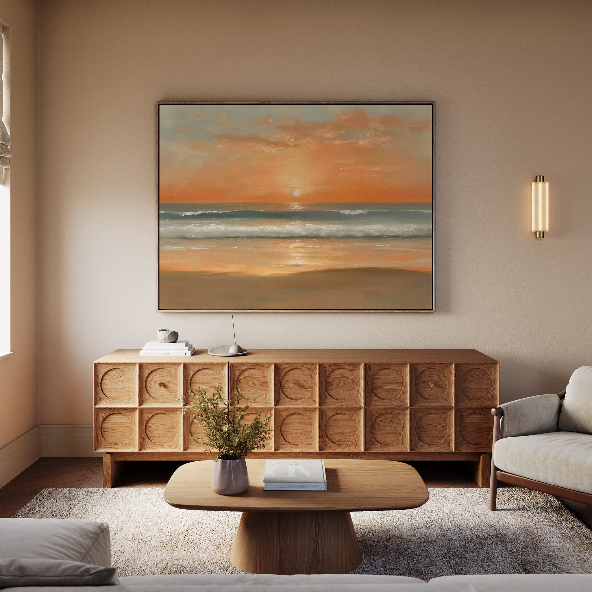 A modern living room with a beige sofa, light wood coffee table, and a sideboard displaying the Amber Horizon Canvas Art - Horizontal. Soft lighting and a flower vase complete the calm, inviting Nordic Park-inspired atmosphere.