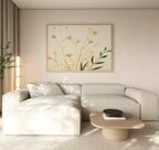 A modern living room with a light beige sectional sofa, wooden coffee table with black bowl, and the Autumn Botanicals Canvas Art - Horizontal on the wall. Sunlight streams in, creating a calm and minimalist vibe.
