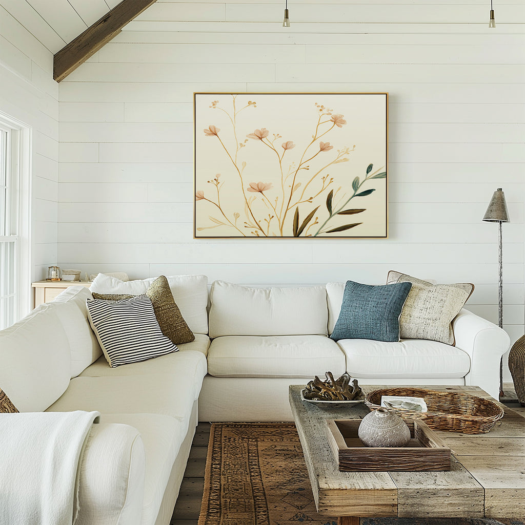 A cozy living room features a white sectional sofa, assorted throw pillows, a rustic wooden coffee table, and the Autumn Botanicals Canvas Art - Horizontal on a white shiplap wall. Natural light fills the space for a warm, inviting feel.