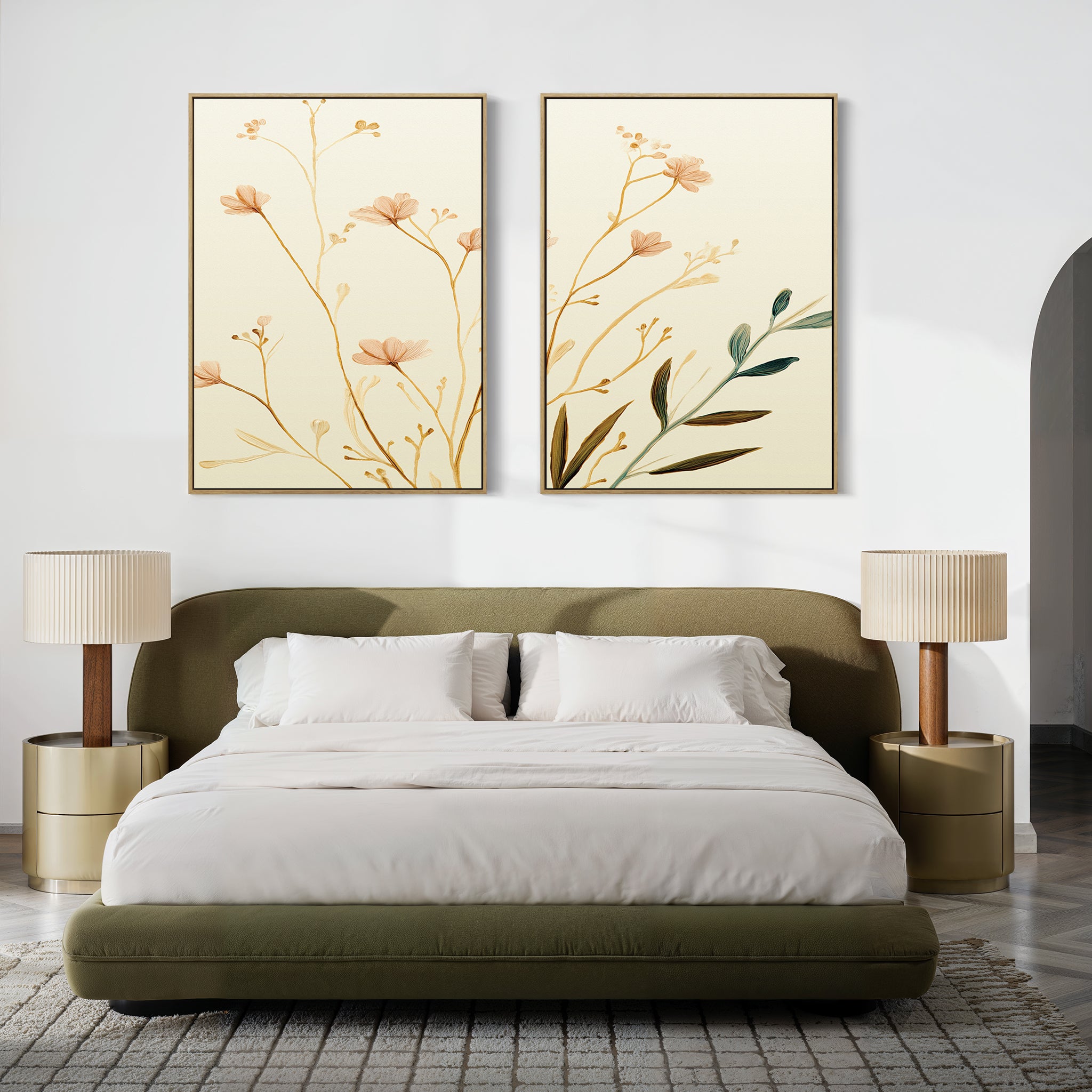 A modern bedroom with an olive-green upholstered bed, white bedding, gold nightstands with beige lamps, and the Autumn Botanicals - Set of 2 canvas prints above the bed for a touch of botanical elegance.