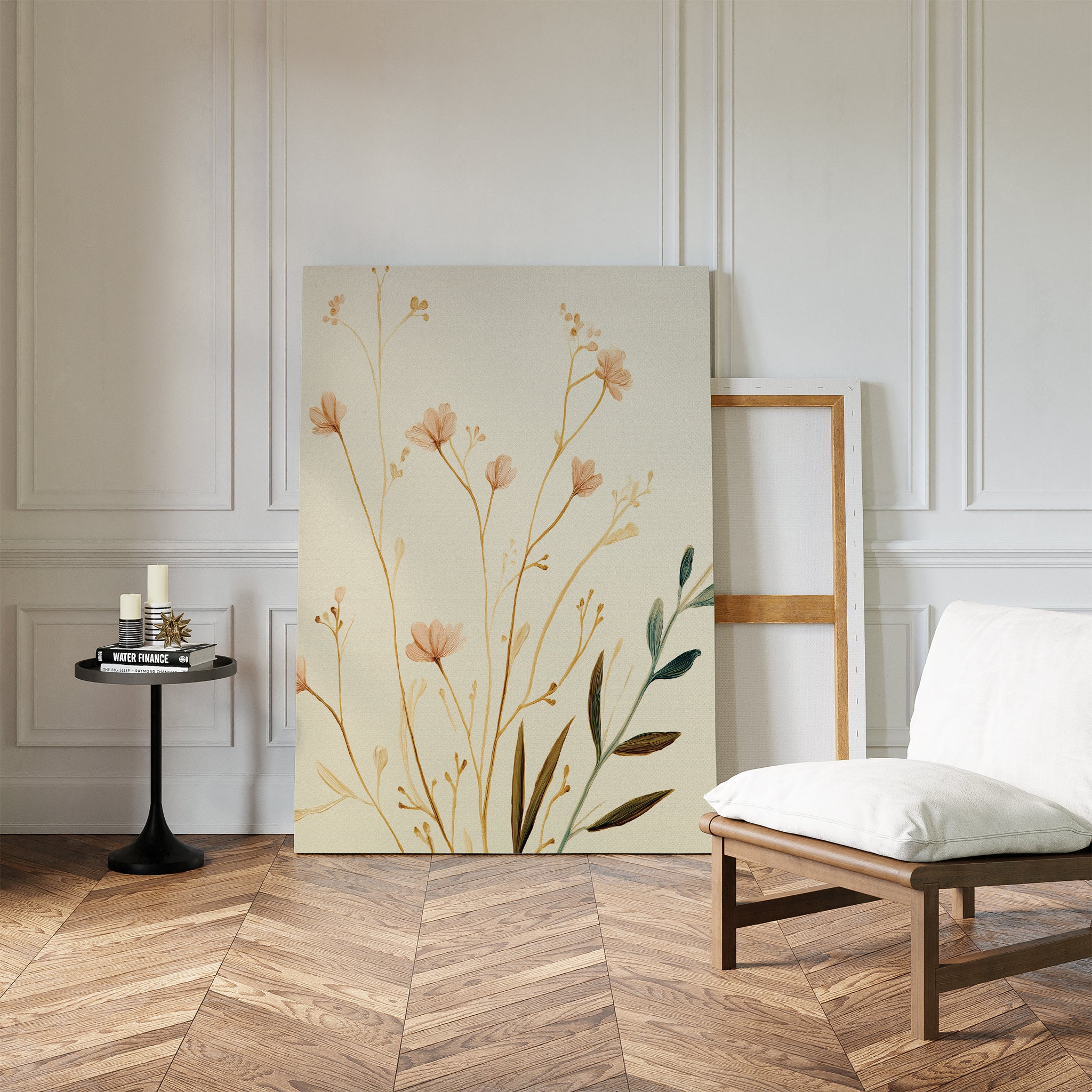 A minimalist room with herringbone floors features a white cushioned chair, a small round black table with candles and books, and the Autumn Botanicals Canvas Art - Vertical leaning against a white paneled wall.