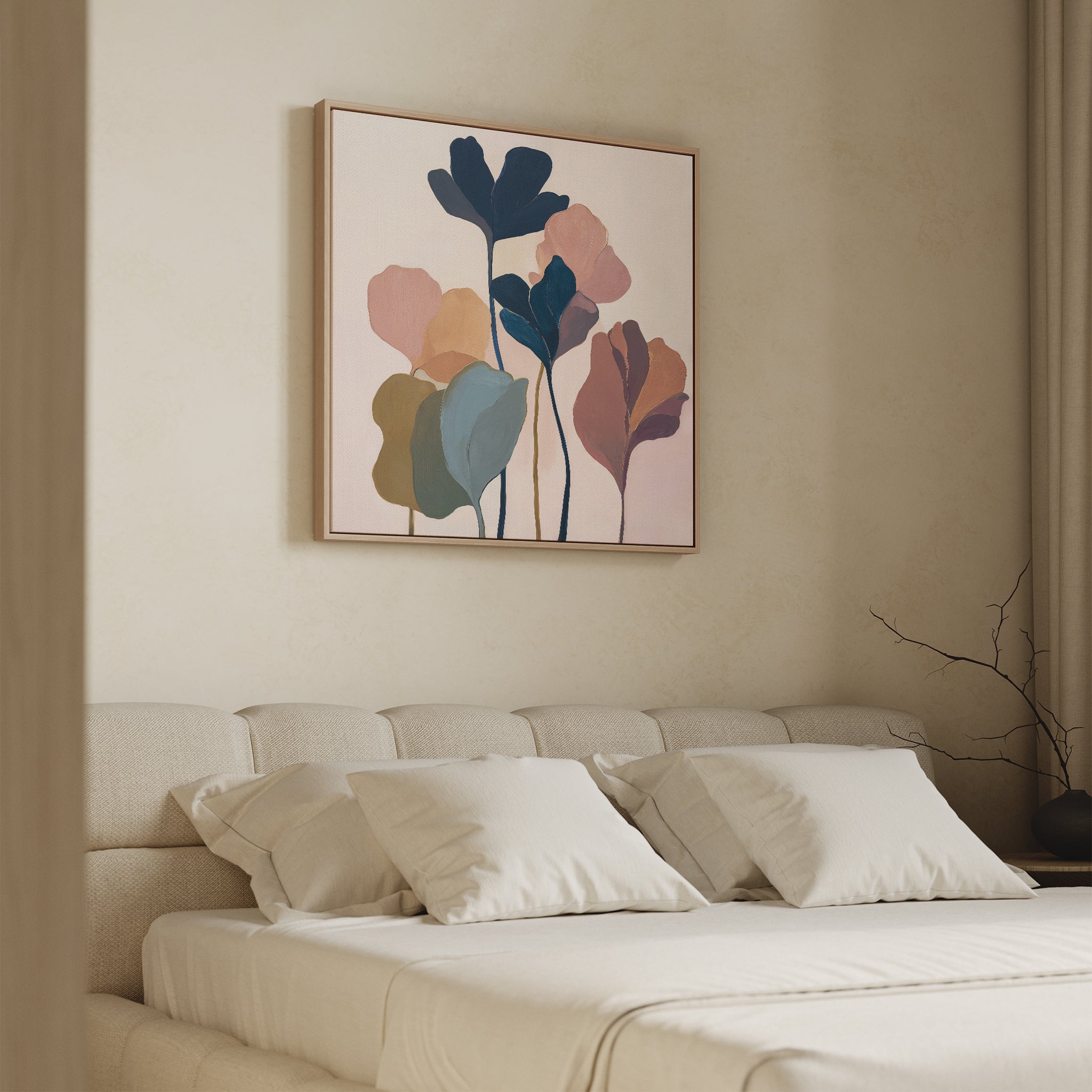 A modern bedroom features a beige upholstered bed with white pillows and the Autumn Garden Canvas Art - Square, a minimalist botanical piece in muted tones, hanging above the headboard. A bare branch decorates the nightstand.