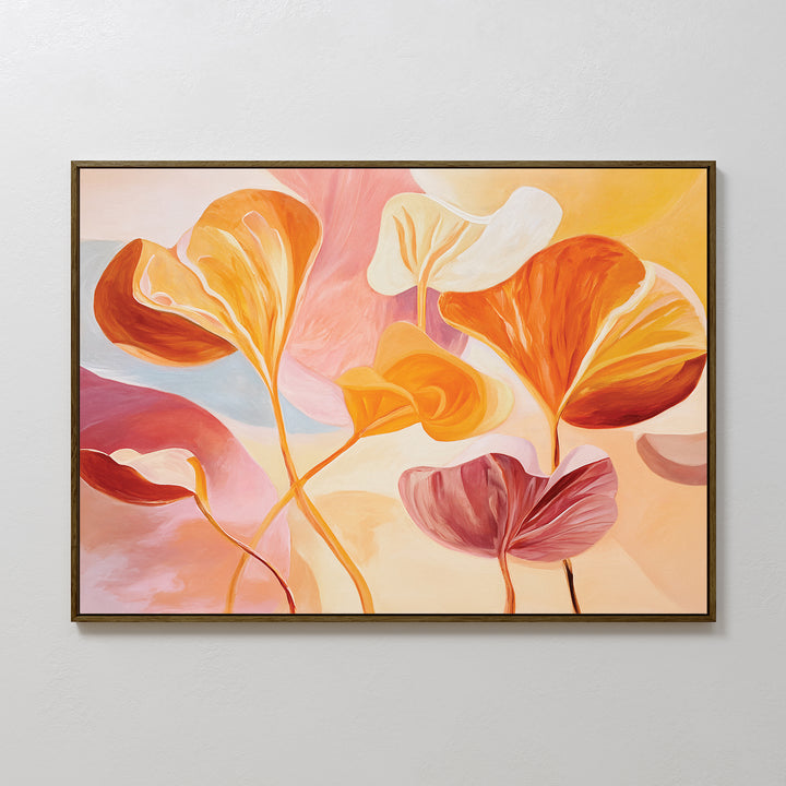 The Autumn Reverie Canvas Art - Horizontal showcases large, flowing botanical leaves in warm orange, yellow, pink, and cream tones on a soft pastel background, beautifully framed with a thin dark frame for a modern look.