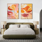 A modern bedroom featuring a green upholstered bed, white bedding, two gold nightstands with beige lamps, and the "Autumn Reverie - Set of 2" botanical wall art displayed above the headboard.