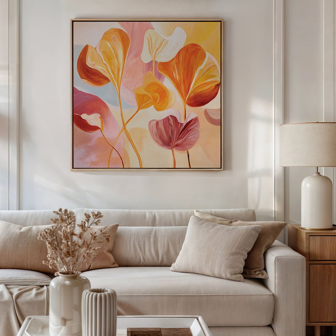 A modern living room with a beige sofa, neutral cushions, a side table with a white lamp, dried flowers in vases, and the Autumn Reverie Canvas Art - Square as striking botanical wall decor above the sofa.