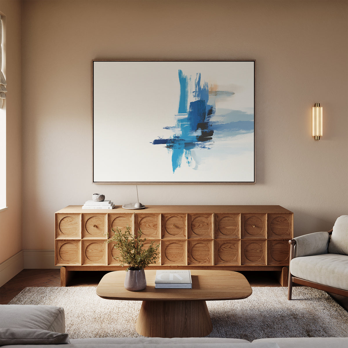 A modern living room with neutral walls, wooden furniture, a low coffee table, a textured sideboard, a beige sofa, and modern wall art—Azure Convergence Canvas Art - Horizontal—hanging above the sideboard.