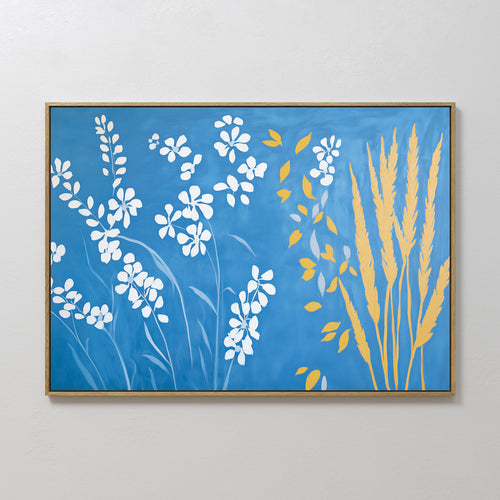 The Azure Meadow Canvas Art - Horizontal features white flowers and yellow wheat-like plants on a blue background, offering modern, minimalist botanical wall art for any room.