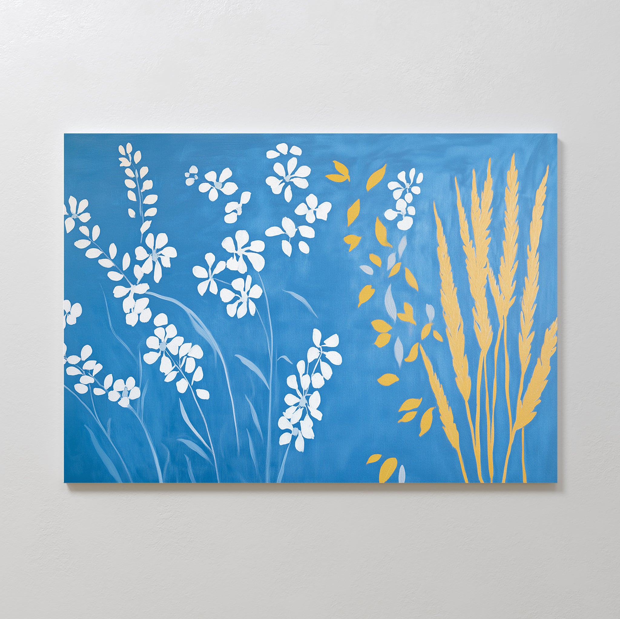 Azure Meadow Canvas Art - Horizontal features white floral silhouettes on the left and yellow wheat-like plants on the right, set against a blue background—a perfect botanical wall art accent for your space.
