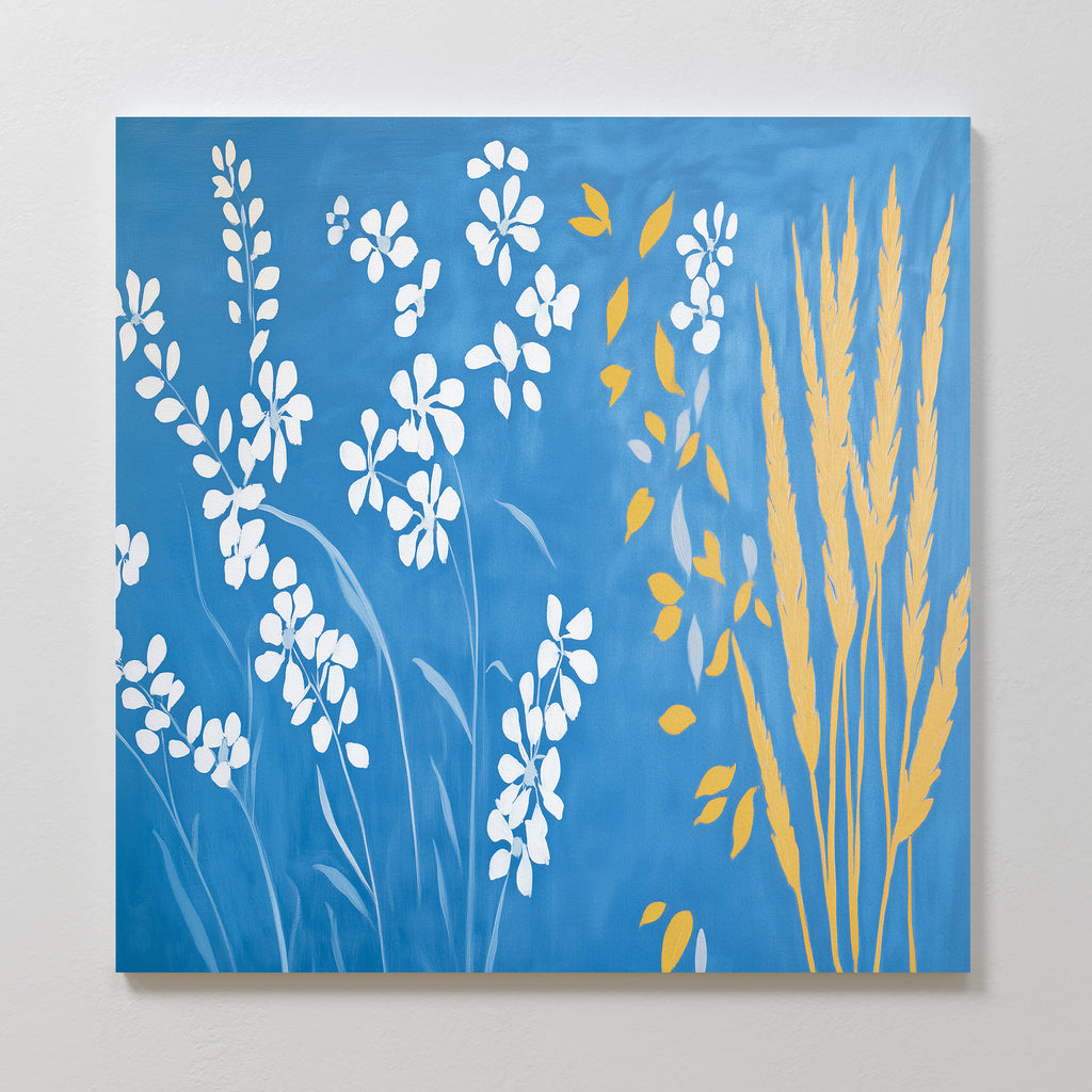 The "Azure Meadow Canvas Art - Square" showcases white wildflowers and wheat-like plants with yellow leaves on a blue backdrop, adding minimalistic botanical elegance and a natural touch to any room.