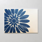 The Azure Radiance Canvas Art - Horizontal showcases an abstract blue flower with bold petals on a light beige background, making it a perfect floral canvas print to enhance your modern living room decor. The vivid design radiates from the left side of the canvas.