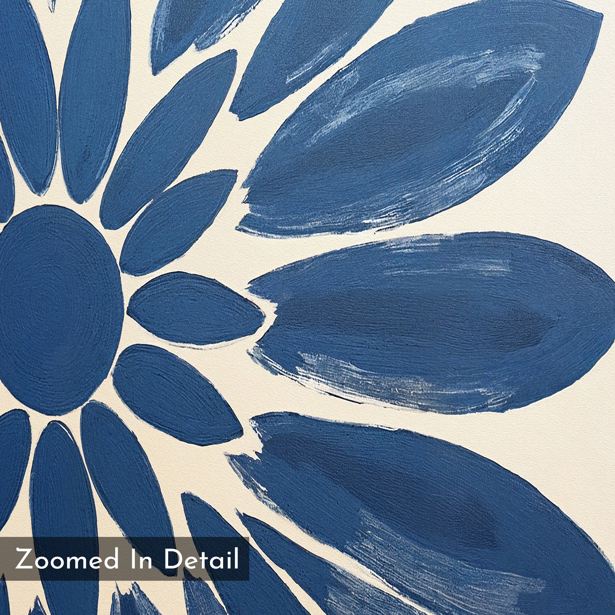 A close-up of a painted blue flower with textured brush strokes on a cream background, ideal as indigo wall décor. “Zoomed In Detail” appears in the lower left. Shown: Azure Radiance Canvas Art - Square.
