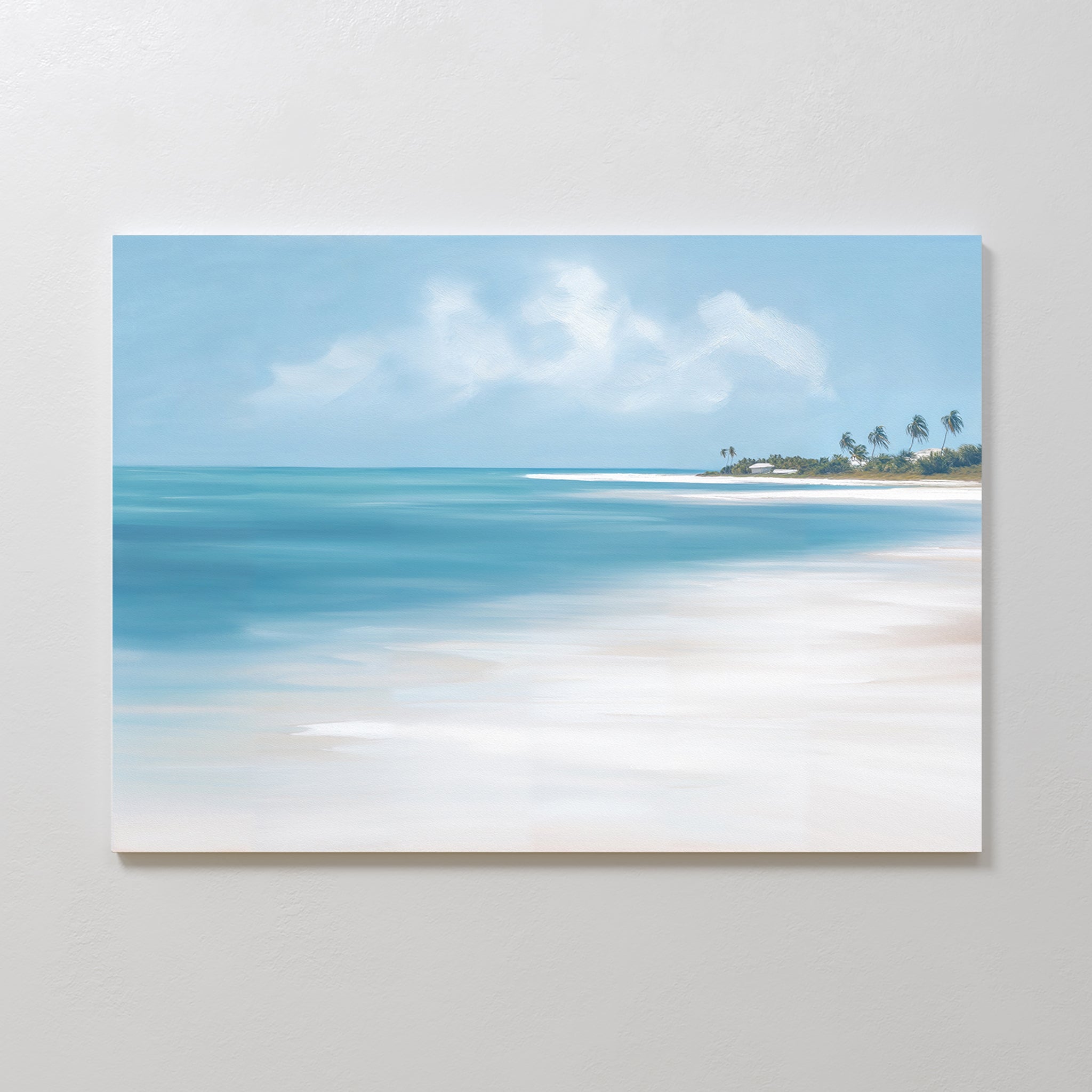 The Azure Tranquility Canvas Art - Horizontal features a serene beach with turquoise waters, white sand, and distant palms beneath a partly cloudy sky, beautifully displayed on a light-colored wall.