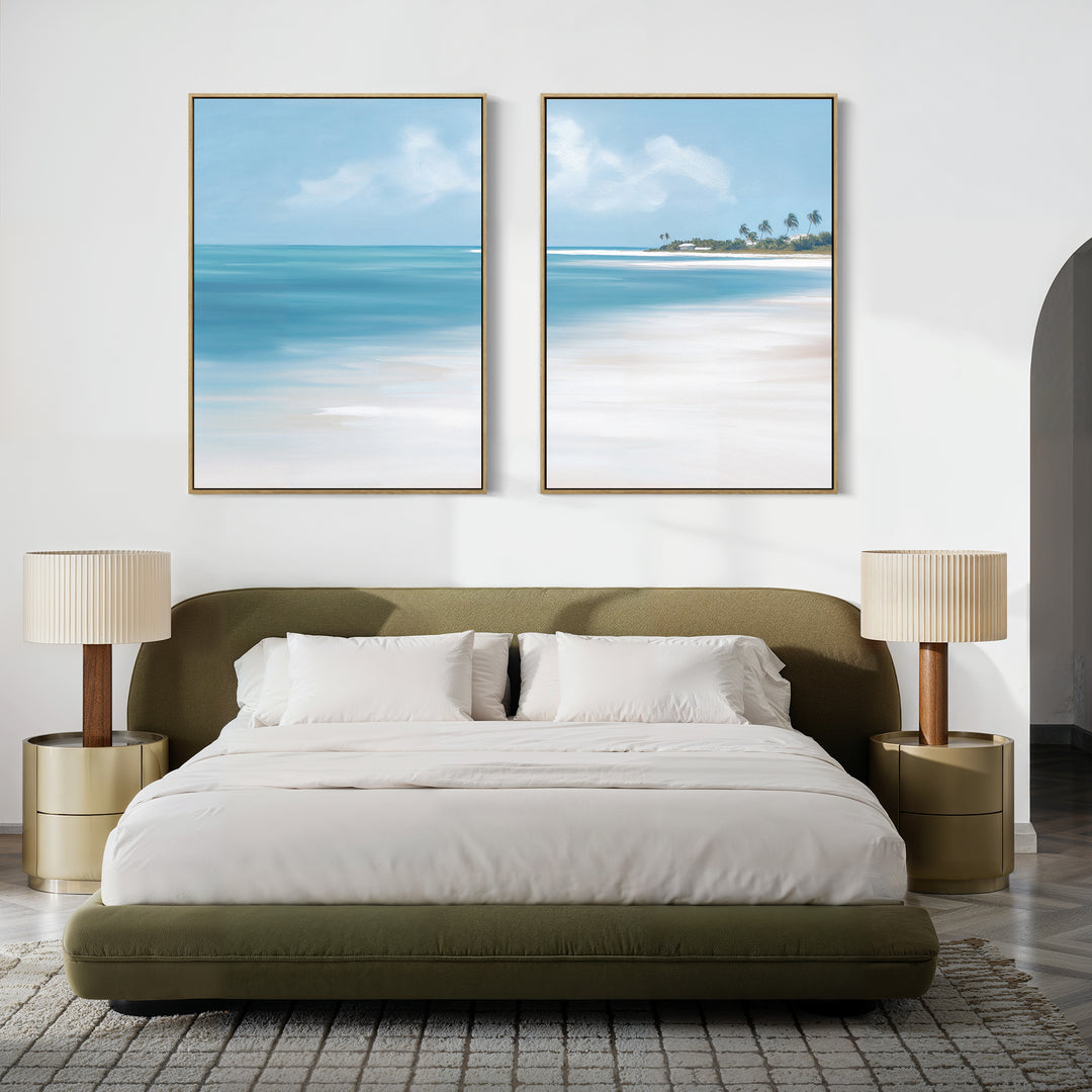 A modern bedroom with a green upholstered bed, white bedding, two beige nightstands with lamps, and serene wall art—Azure Tranquility - Set of 2—featuring large beach-themed paintings above the bed.