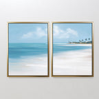 The "Azure Tranquility - Set of 2" features framed canvas prints of a serene beach with turquoise waters, white sand, and distant palm trees—perfect for adding calming coastal art to any space.