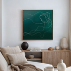 Modern living room with a neutral sofa, decorative vases, and books on a wooden cabinet, featuring the Azure Silhouette Abstract Canvas Art—a minimalist line drawing of a woman with flowing hair on green—perfect for stylish decor.