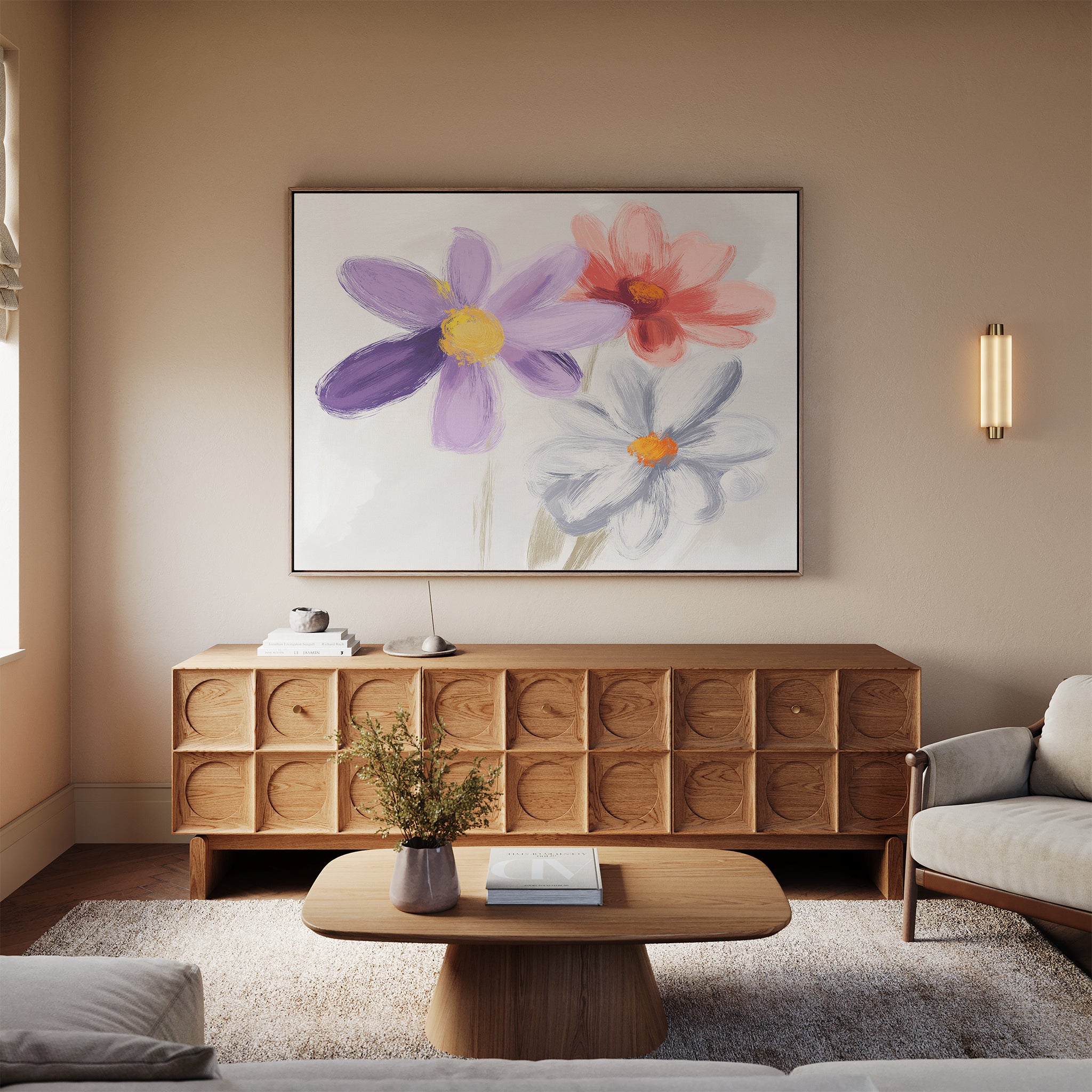 A cozy living room with a modern wooden sideboard, light sofa, wooden coffee table, beige rug, and the Blooming Harmony Canvas Art - Horizontal featuring purple, red, and white flowers hanging above the sideboard.