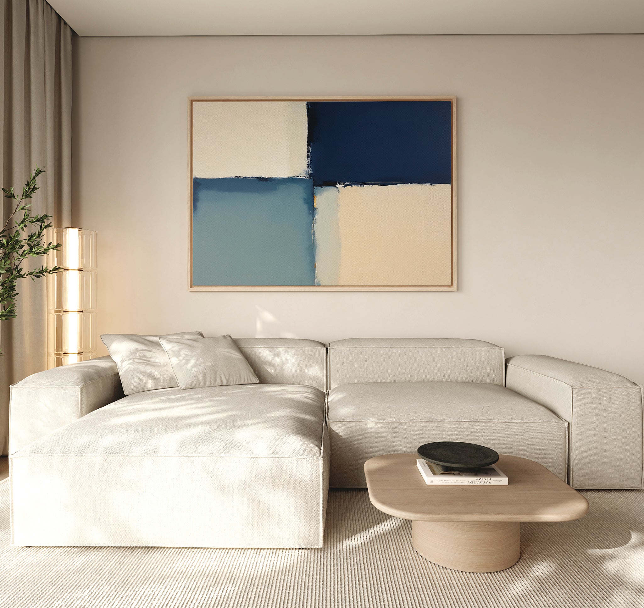 A modern living room features a light beige sectional, a round wood coffee table, and the Blue Quarters Canvas Art - Horizontal above. Sunlight fills the calm, minimalist space, making it perfect for contemporary living rooms.