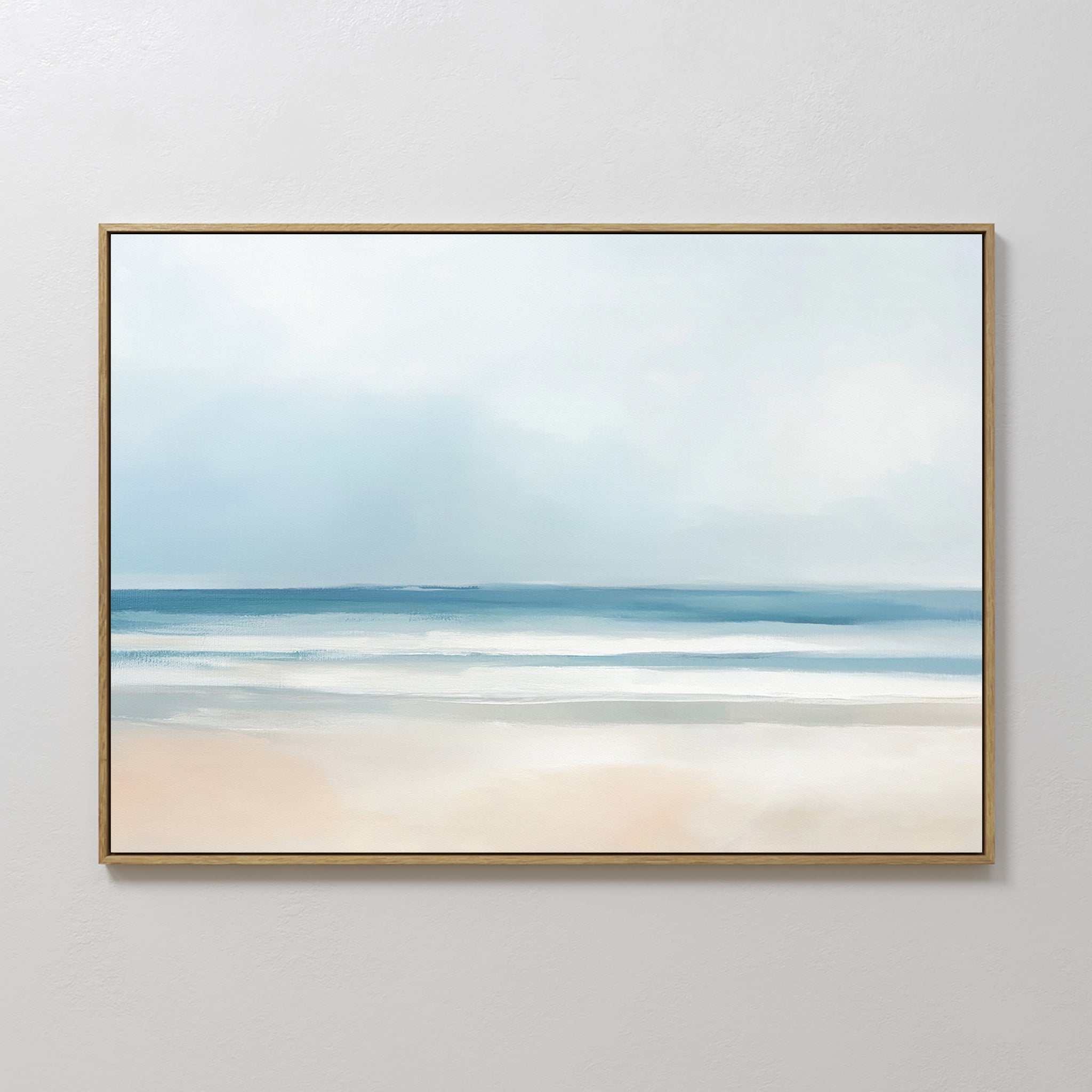 Blurred Beach Scene Canvas Art - Horizontal features a serene coastal landscape with soft blue sky, gentle waves, and pale sand in muted tones—ideal for adding tranquil, minimalist style to your wall décor.