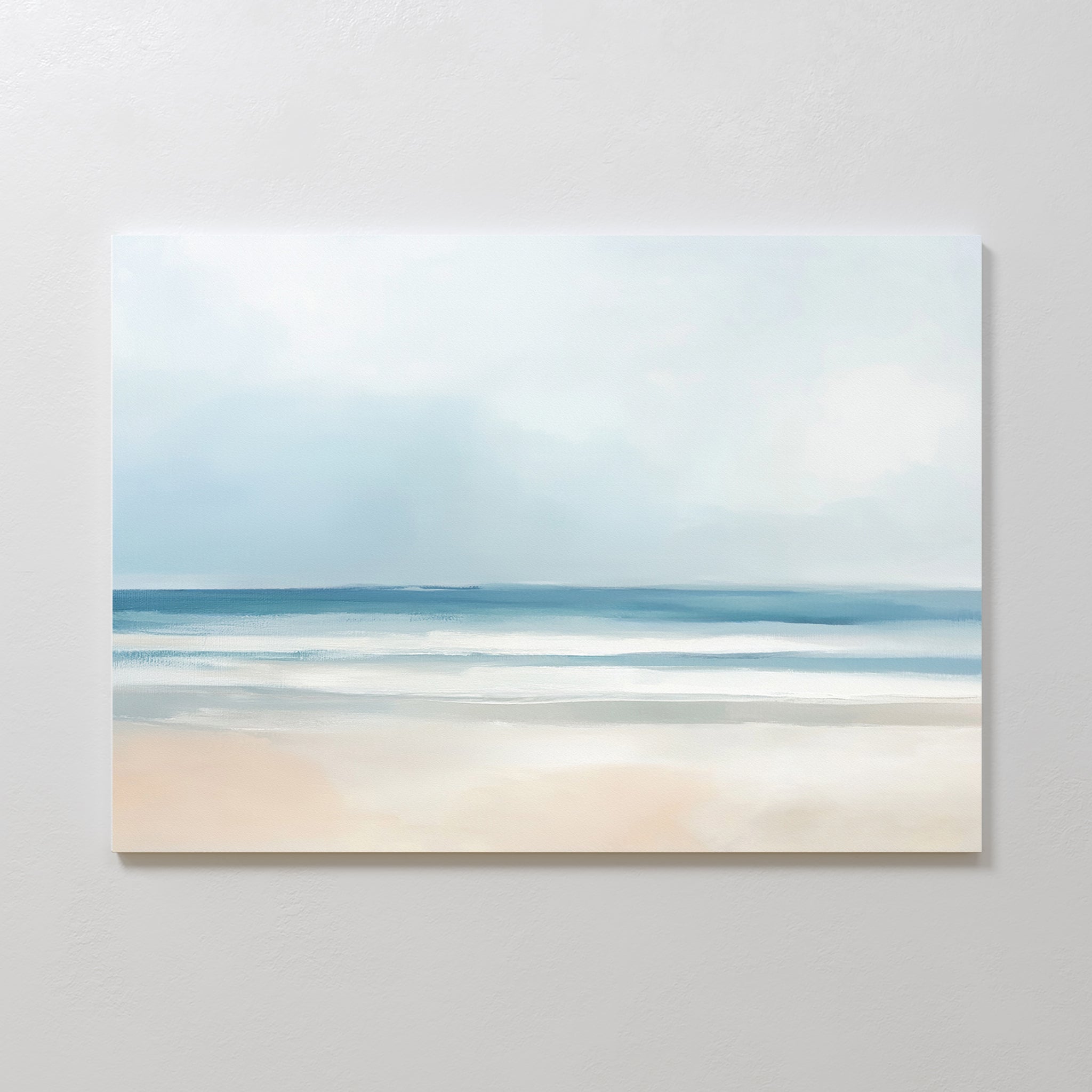 The Blurred Beach Scene Canvas Art - Horizontal features a minimalist coastal print with soft blue and white tones of the sea, sky, and sand, creating a calm, serene atmosphere—ideal for tranquil wall decor.