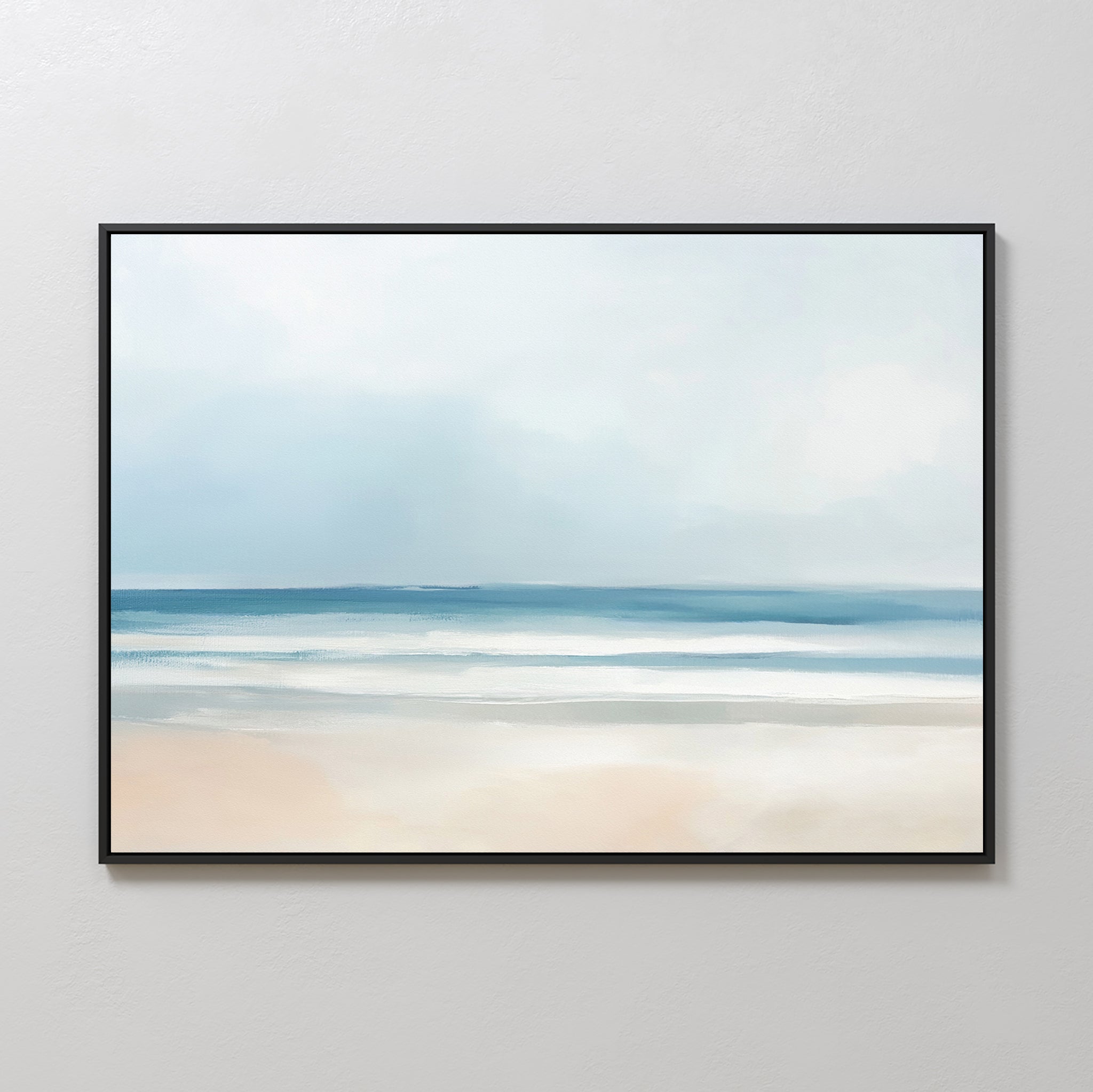 The Blurred Beach Scene Canvas Art – Horizontal features a serene beach with soft blue and white tones, gentle waves, and sandy shore, perfect as tranquil wall art for any light-colored room.