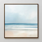 The Blurred Beach Scene Canvas Art - Square features a serene coastal print with soft blue waves, gentle white surf, and a pale sandy shore beneath a hazy sky. Its minimal colors and smooth brushstrokes create calming wall decor.