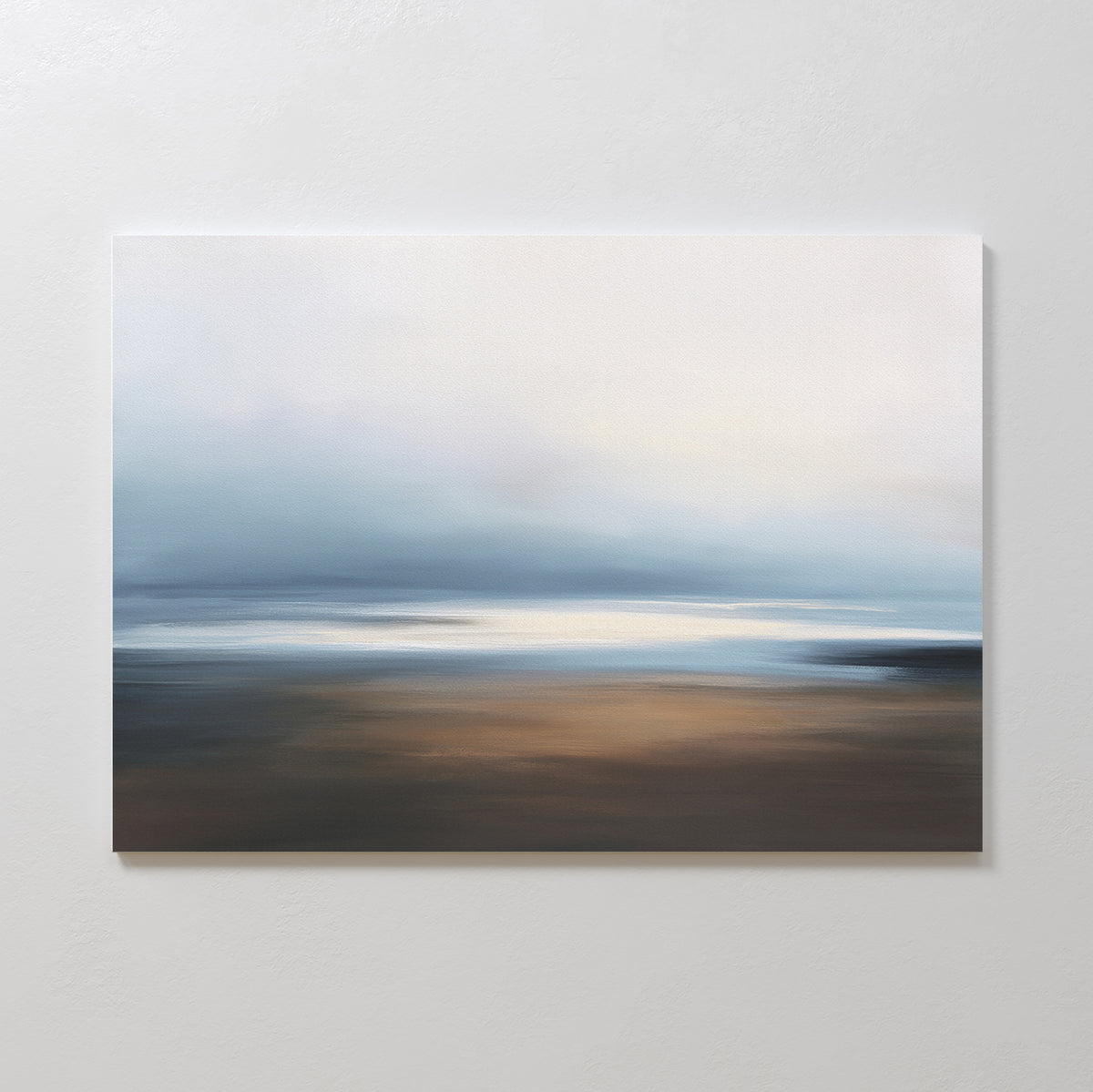The Blurred Seascape Canvas Art - Horizontal features soft, blurred tones of blue, white, and brown, capturing a calm ocean under a hazy sky for peaceful minimalist coastal décor.