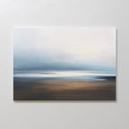 The Blurred Seascape Canvas Art - Horizontal features soft, blurred tones of blue, white, and brown, capturing a calm ocean under a hazy sky for peaceful minimalist coastal décor.