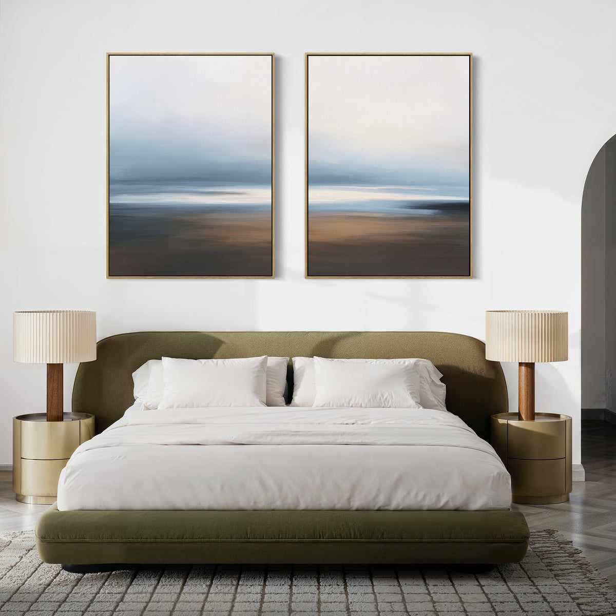 A modern bedroom features a green upholstered bed, white bedding, beige nightstands with lamps, a gray textured rug, and the Blurred Seascape - Set Of 2 wall art above the bed for a serene coastal touch.
