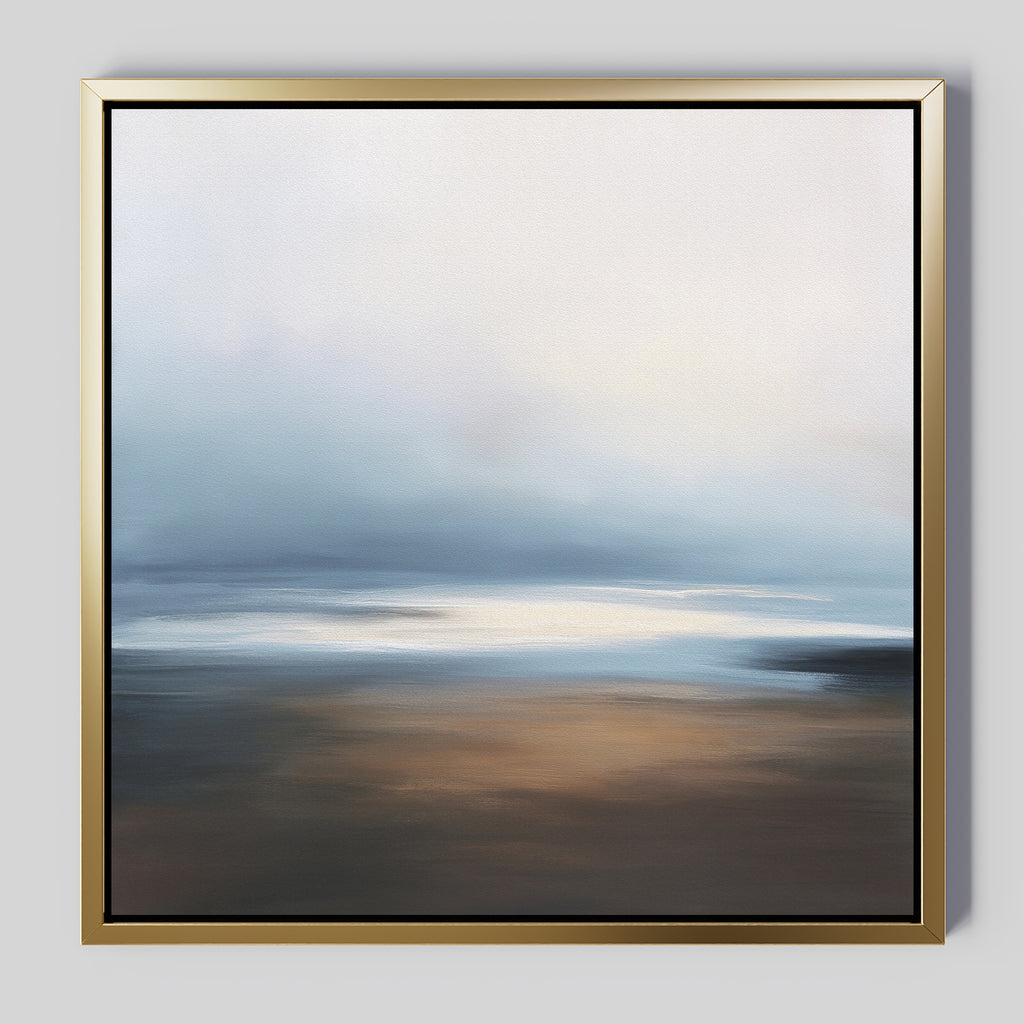 Blurred Seascape Canvas Art - Square: A gold-framed abstract painting with soft blues, whites, browns, and beiges, evoking a serene misty sky and reflective water for a tranquil atmosphere.