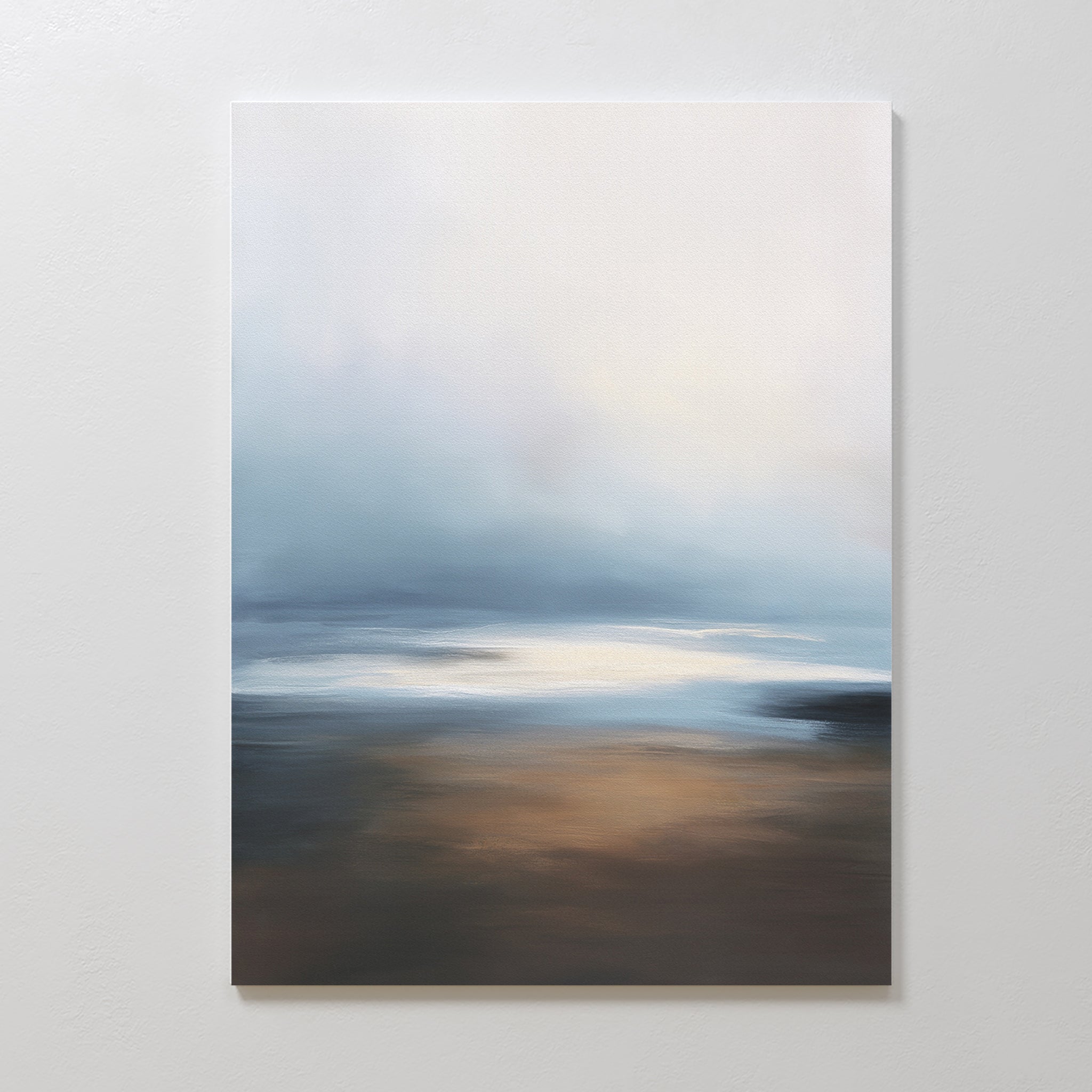 The Blurred Seascape Canvas Art - Vertical features a minimalist, abstract design with soft blue, white, and brown tones, capturing coastal serenity in a tranquil depiction of a hazy sky and reflective water.