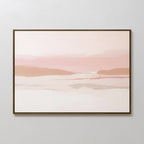 Blush Mesa Canvas Art - Horizontal features a serene landscape in soft pink, peach, and beige earth tones, with hills and calm water—perfect minimalist decor for a light wall, elegantly framed in a simple dark frame.