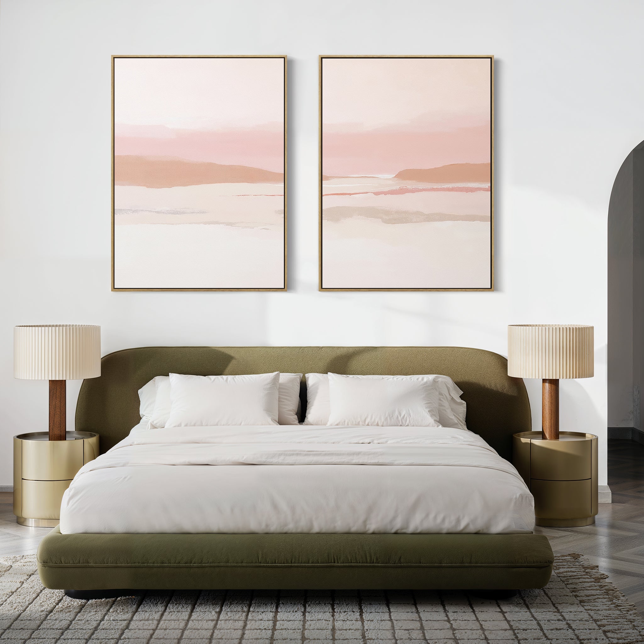 A modern bedroom with a green upholstered bed, white bedding, two beige nightstands with matching lamps, and the Blush Mesa - Set Of 2 earth-toned prints above the bed. A gray rug covers the floor.