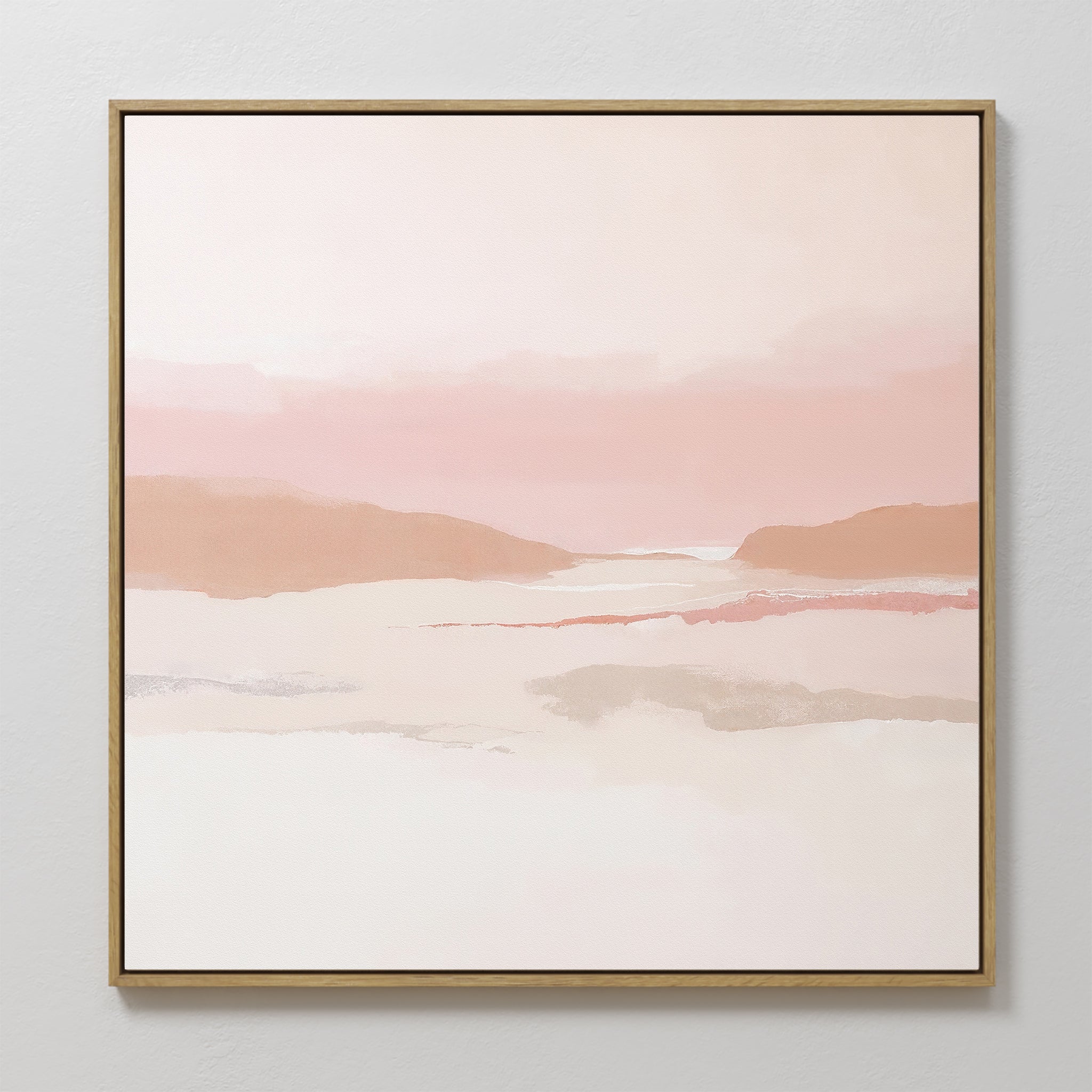 The Blush Mesa Canvas Art - Square features minimalist wall art with abstract hills in pastel pink, peach, and cream. Soft earth tones and a hazy sky are framed by a thin border, perfect for brightening any light-colored wall.