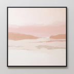 The Blush Mesa Canvas Art - Square is a minimalist wall piece featuring soft pastel earth tones of pink, peach, and beige in abstract hills under a calm sky, framed in black and displayed on a light-colored wall.