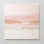 The Blush Mesa Canvas Art - Square showcases minimalist wall art in soft pink and beige earth tones, with gentle hills and a hazy sky, beautifully displayed on a light-colored wall.