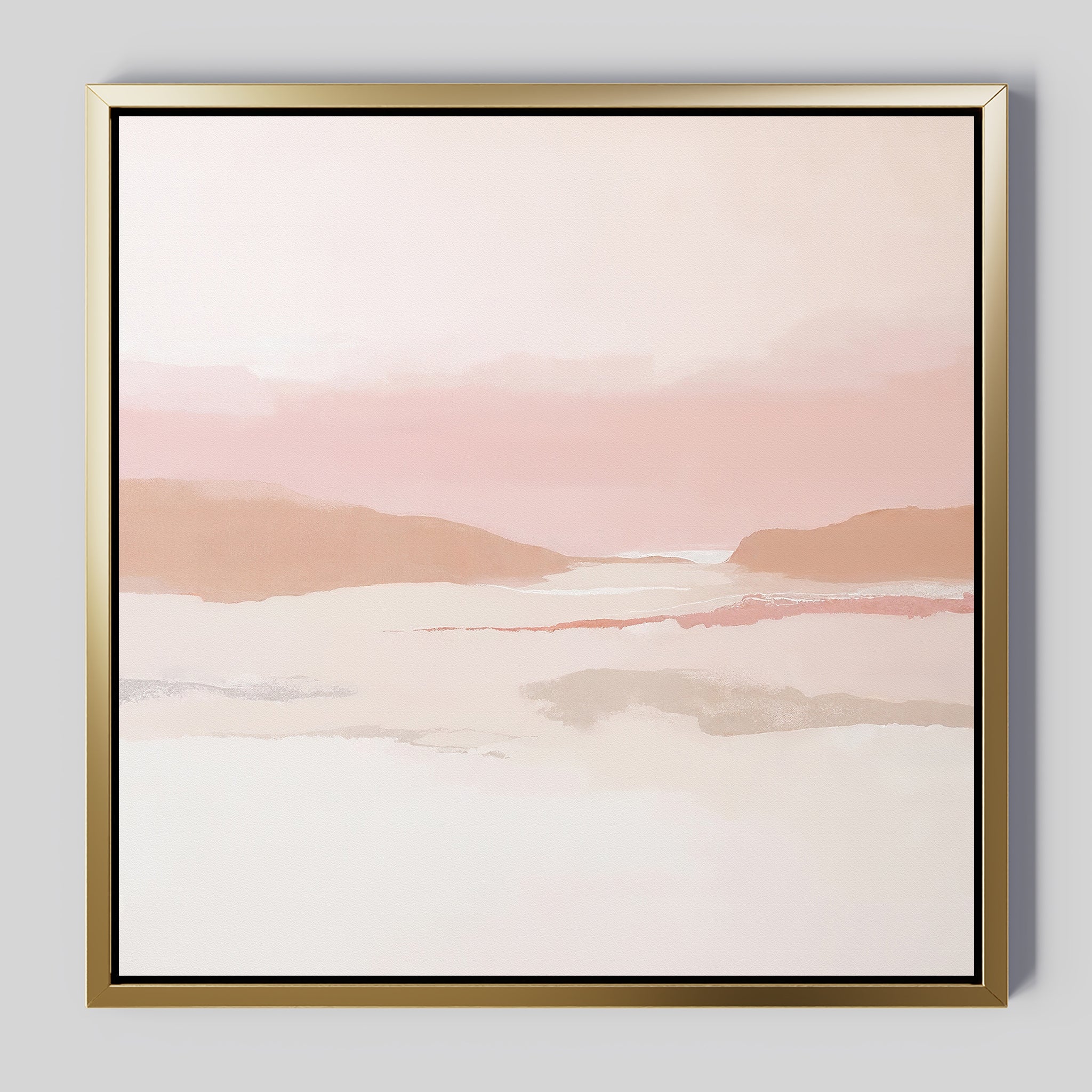 The Blush Mesa Canvas Art - Square features a minimalist abstract landscape in soft pink and beige earth tones with gentle hills and a hazy sky, set in a gold frame against a light gray background.