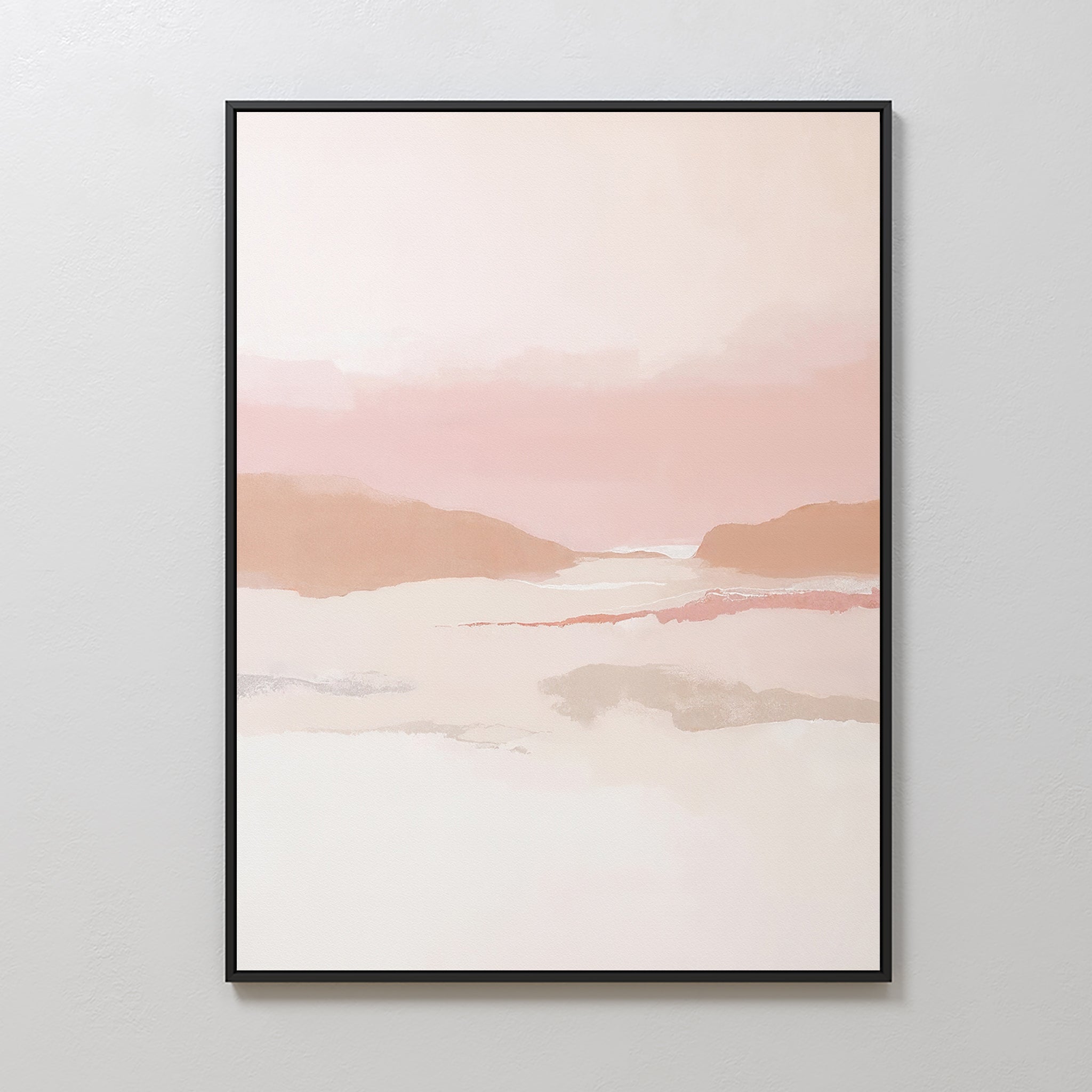 The Blush Mesa Canvas Art - Vertical, a framed minimalist piece with soft pink, peach, and beige tones evoking gentle hills and a tranquil sky, is displayed on a plain white wall.