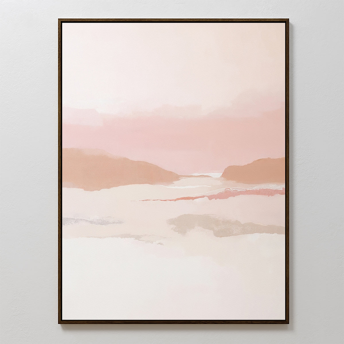 The Blush Mesa Canvas Art - Vertical showcases a minimalist landscape in pastel pink, peach, and beige tones with abstract hills under a cloudy sky, simply framed in dark wood and perfect for light-colored walls.