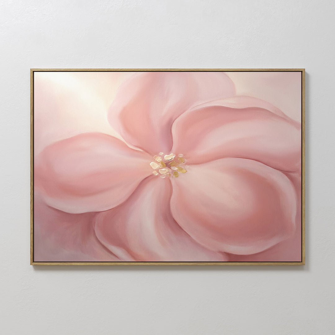 The Blushing Magnolia Canvas Art - Horizontal displays a large soft pink flower with five petals and a light yellow center on a neutral background, adding romantic, modern wall art style to any room.