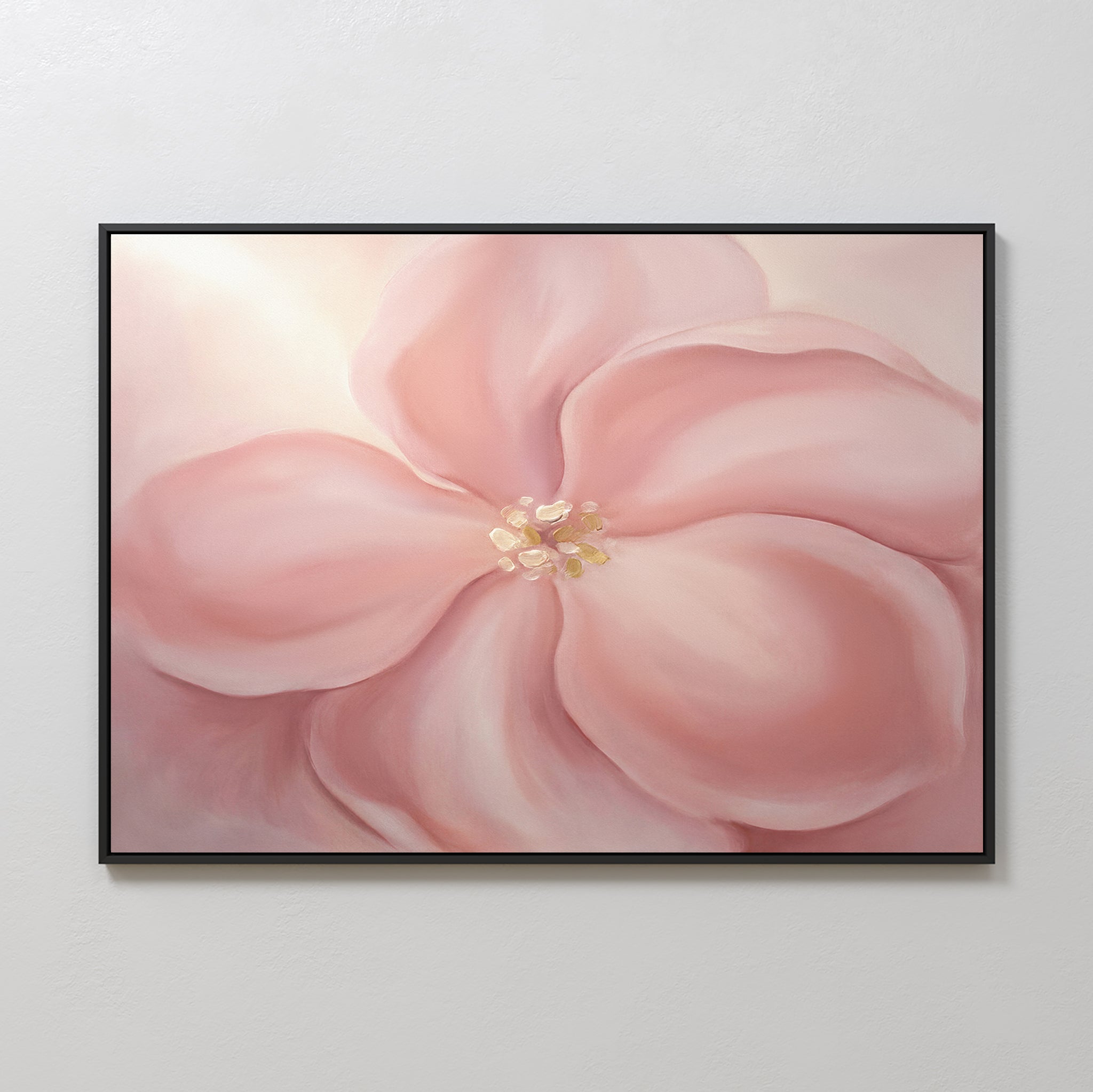 The Blushing Magnolia Canvas Art - Horizontal features a large, soft pink flower with delicate petals and a light yellow center on a neutral background, ideal as romantic wall art for any light-colored space.