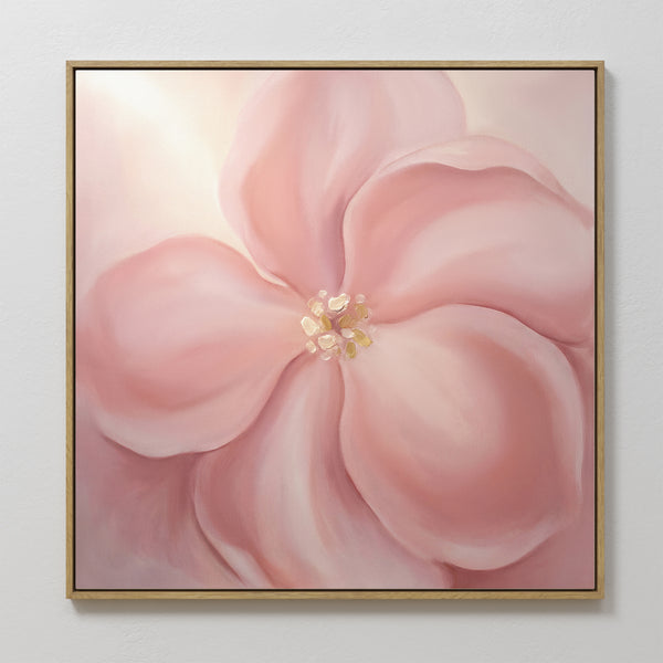 The Blushing Magnolia Canvas Art - Square features a large, soft pink magnolia with delicate petals and a pale yellow center, creating a gentle, dreamy atmosphere—perfect as romantic wall art for your space.