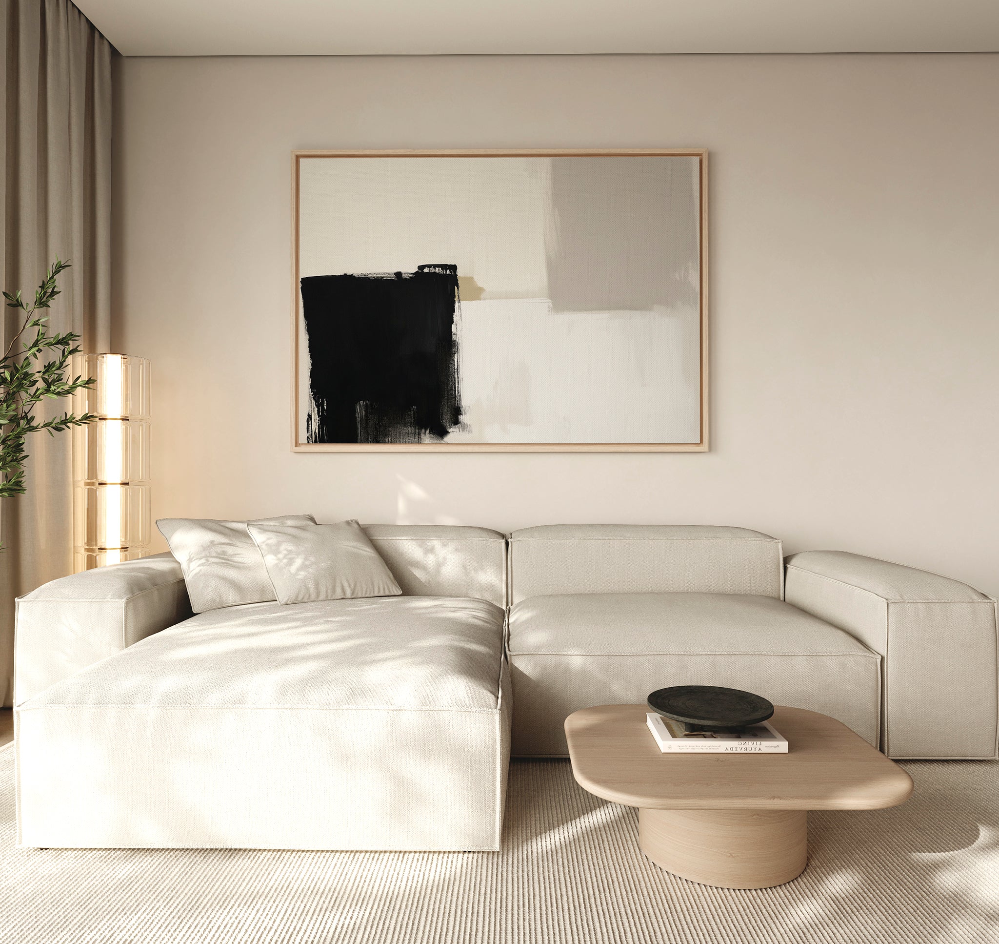 A modern living room showcases a large beige sectional, a light wood coffee table with a black bowl, a tall plant, and the Bold Division Canvas Art - Horizontal—a perfect touch of inspiration for minimalist spaces.