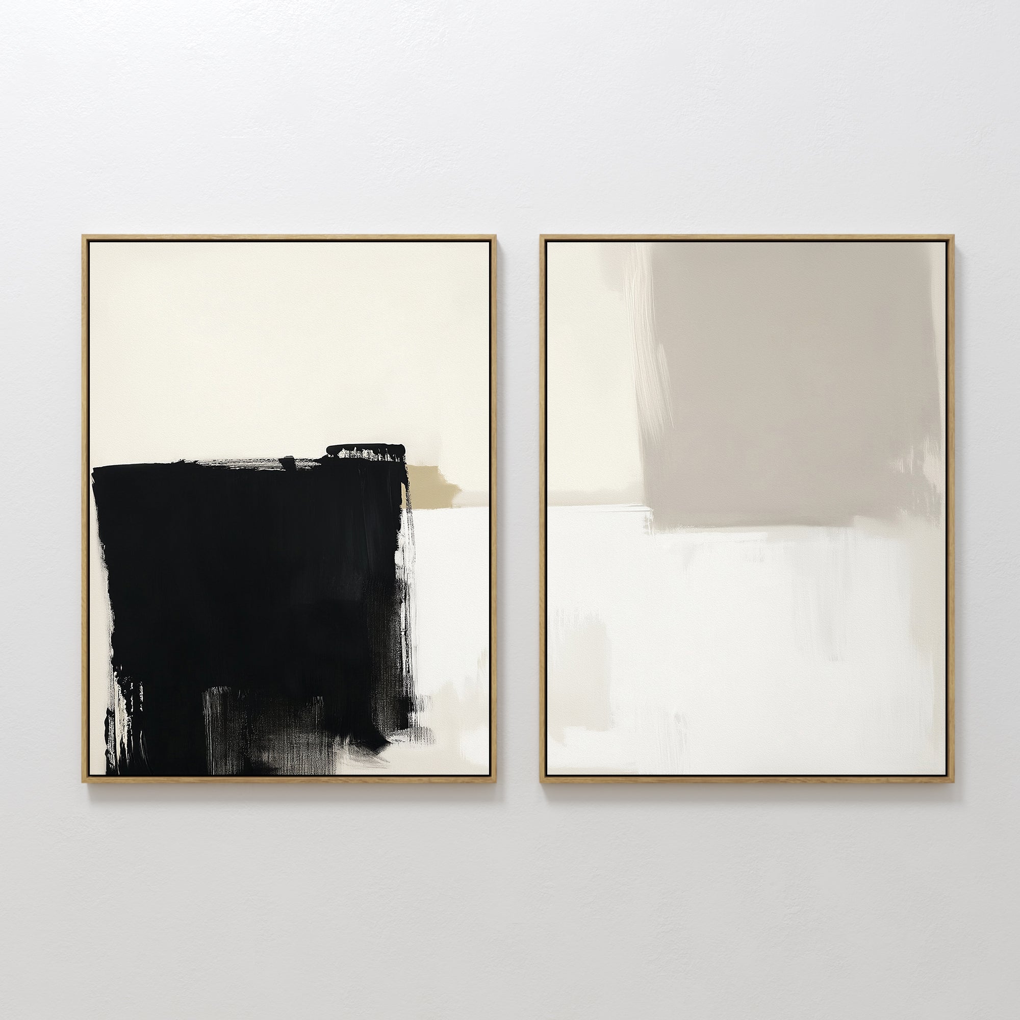 Bold Division - Set Of 2: A pair of framed abstract artworks—one with striking black and beige brushstrokes, the other in soft beige and gray with a minimalist blurred style—ideal for modern living rooms.