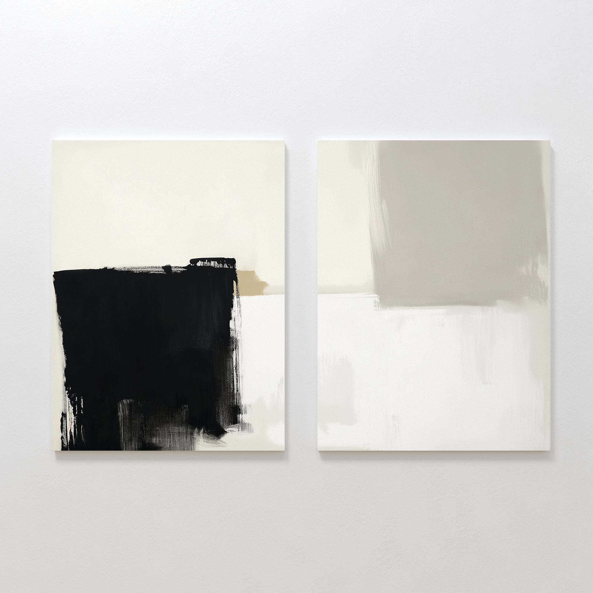 The Bold Division - Set Of 2 features two abstract canvases: one with striking black and beige brushstrokes, the other with soft beige and gray shapes, both on white backgrounds—perfect for adding sophistication to modern living rooms.