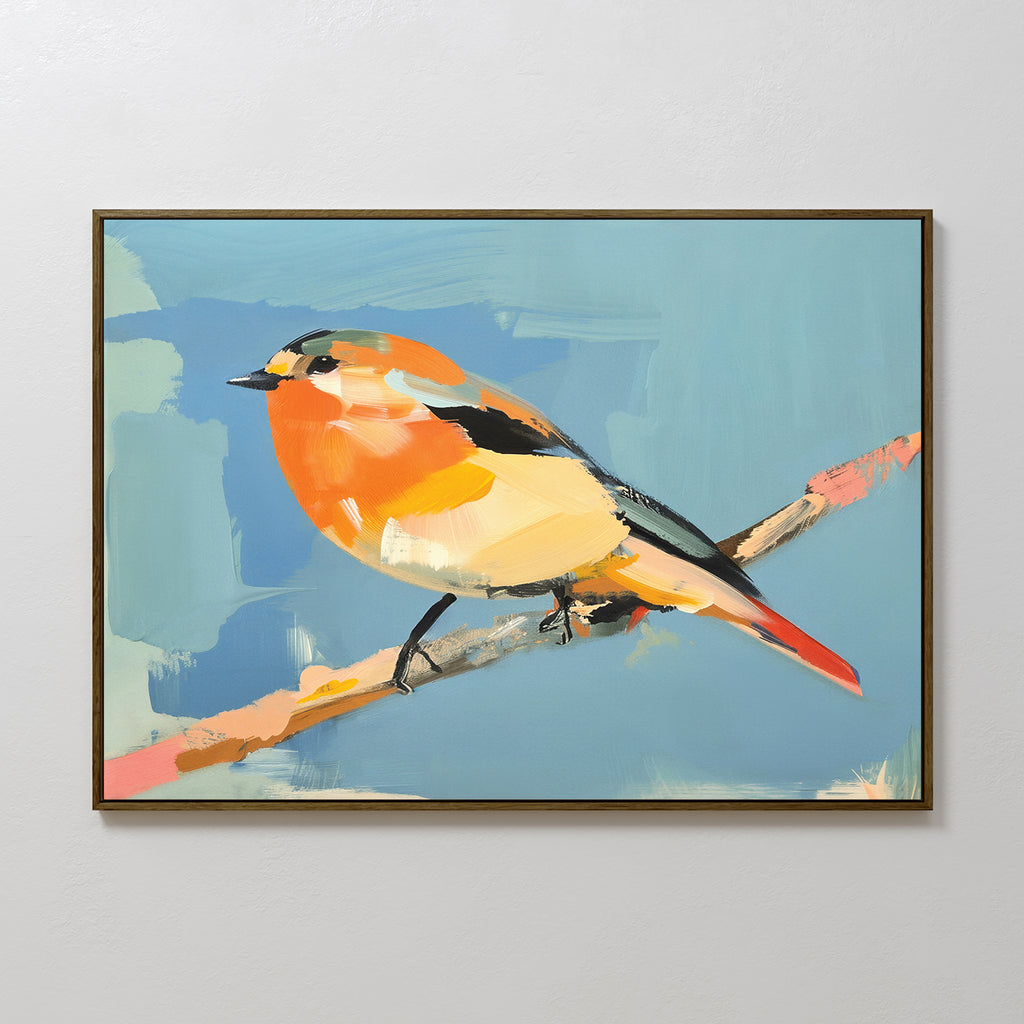 The Bright Songbird Canvas Art - Horizontal features a small bird with orange, yellow, black, and white feathers on a branch against a blue background, beautifully framed and displayed on a white wall.